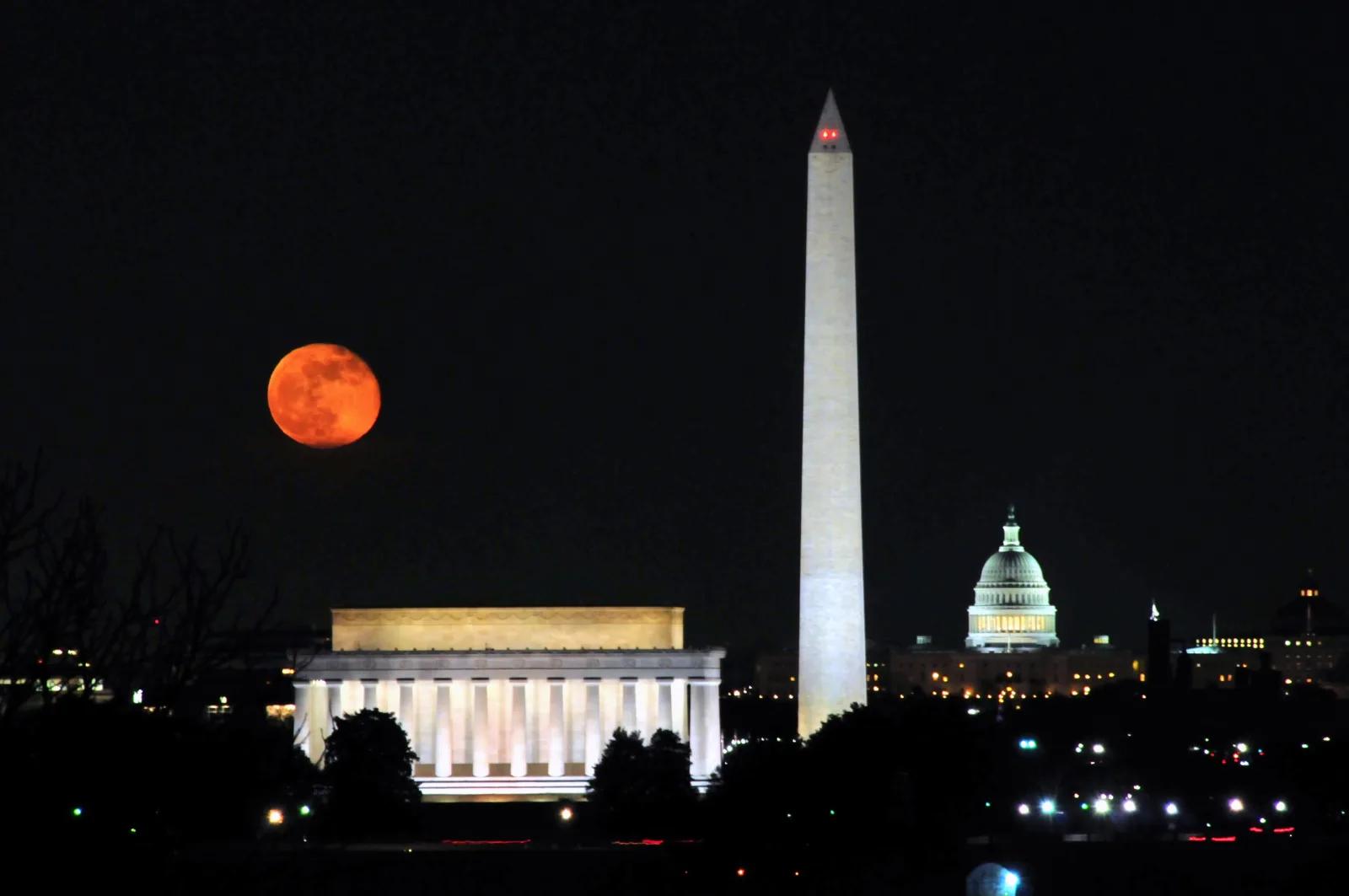 Washington monuments beneath a full moon